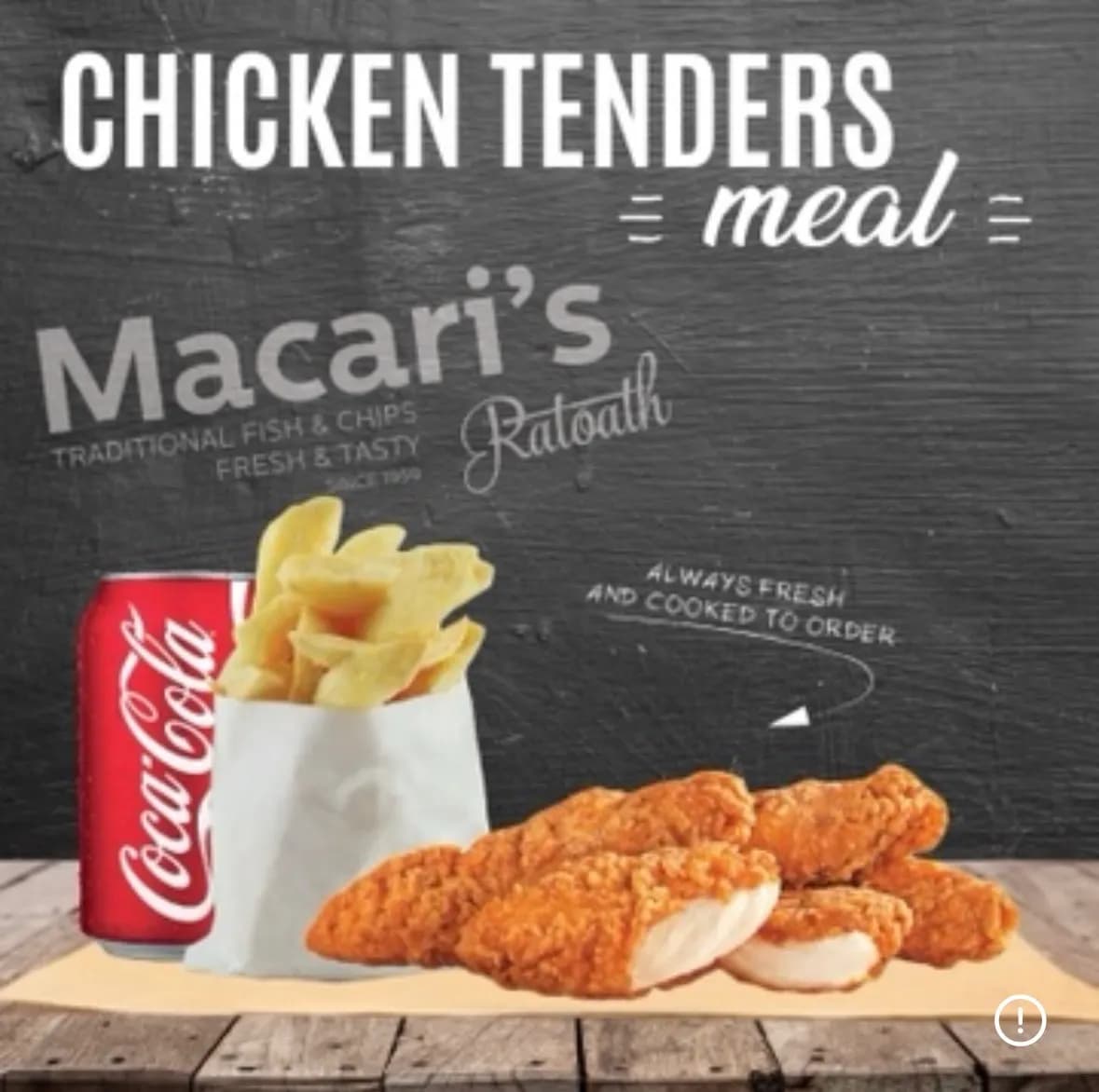 Chicken tenders meal with chips and a can of Coca-Cola, served on a wooden table with a dark chalkboard-style background.